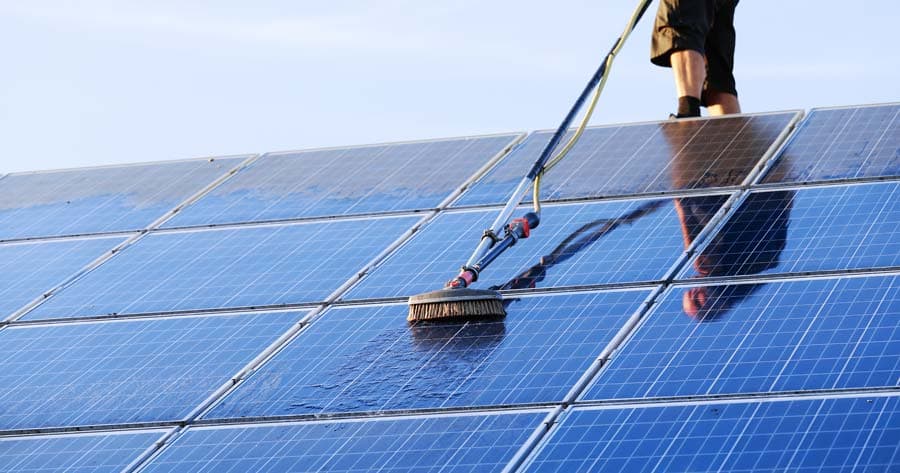 Solar panel cleaning with pure water fed pole system